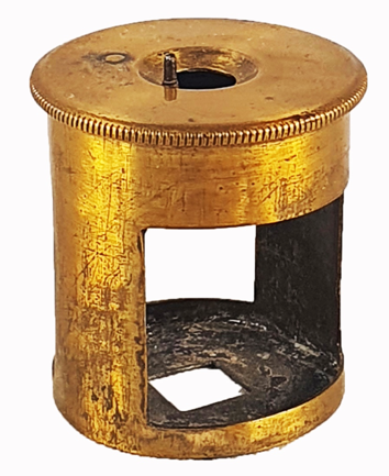 A gold object with a hole
Description automatically generated