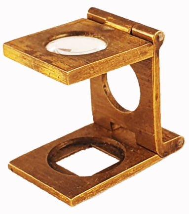 A gold metal magnifying glass
Description automatically generated