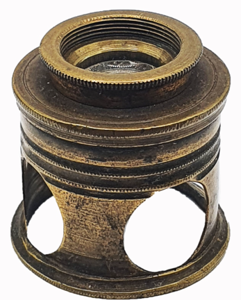 A brass object with holes
Description automatically generated