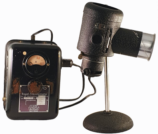 A picture containing indoor, black, electronics, camera
Description automatically generated